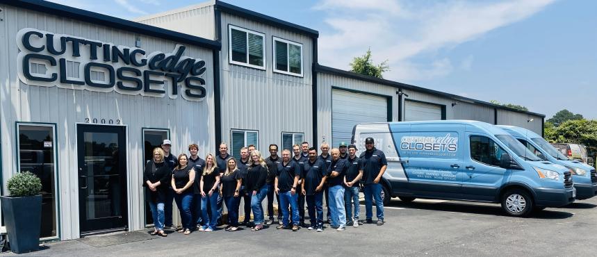 STAFF IN FRONT OF BUILDING.JPG