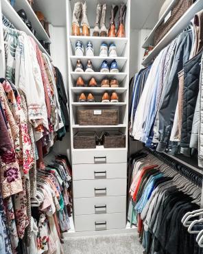 WALK IN CLOSET WITH CLOTHES.JPG